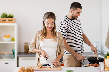 Image showing couple cooking food at home kitchen