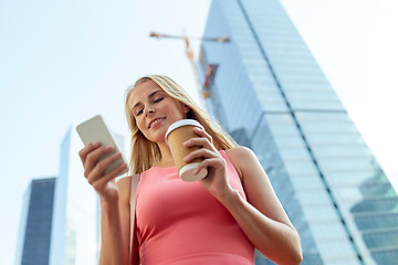 Image showing woman with coffee and smartphone in city