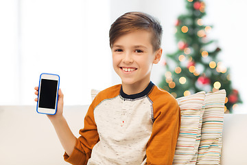 Image showing boy with smartphone at home at christmas