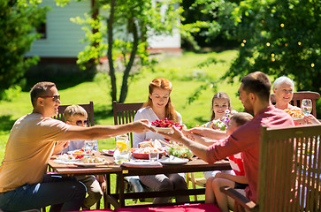 Image showing happy family having dinner or summer garden party