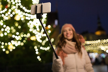 Image showing young woman taking selfie at christmas town