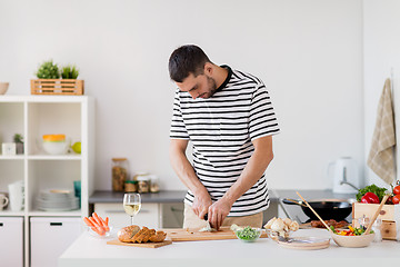 Image showing man cooking food at home kitchen