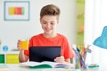 Image showing student boy with tablet pc and juice at home