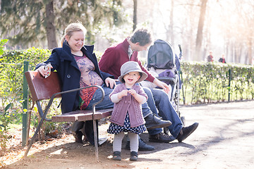 Image showing Young family with cheerful child in the park.