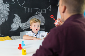 Image showing Cute little toddler boy at child therapy session.