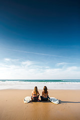 Image showing Surfer girls at the beach 