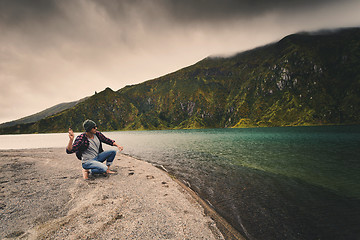 Image showing Man throwing a stone