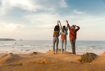 Image showing Girls looking the ocean