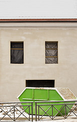 Image showing Construction site. Big green trash container near the wall