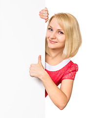 Image showing Woman with blank signboard