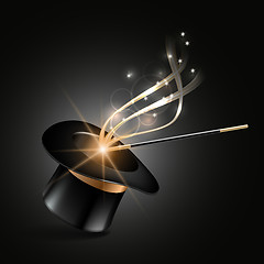 Image showing Magic hat and wand with magical gold sparkle trail