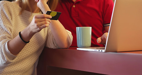 Image showing Couple Using Laptop To Shop Online in modern apartment