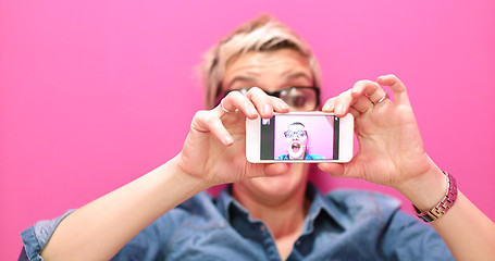 Image showing woman taking selfie in startup office