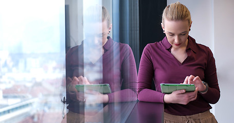 Image showing woman manager using cell telephone in office interior