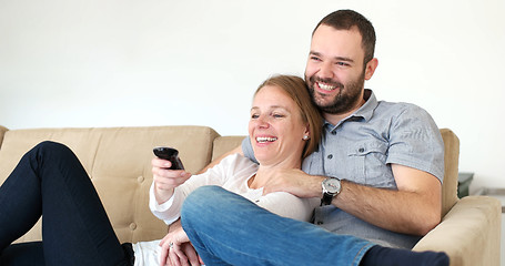 Image showing senoior couple watching tv in modern villa