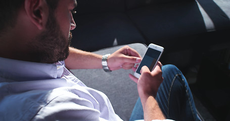 Image showing Senior businessman  using cell phone at  stratup office