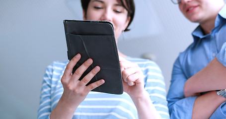 Image showing low angle shot of business people using technology