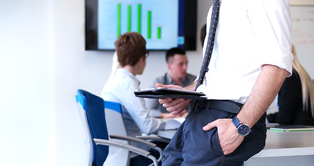 Image showing Businessman using tablet in modern office