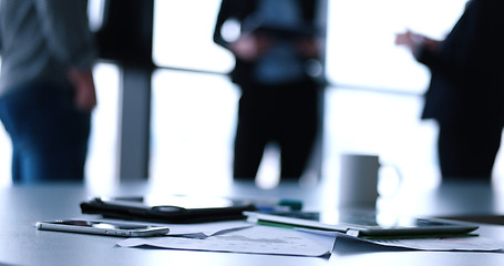 Image showing tablet, mobile cell phone and cup of coffee  in office with busi