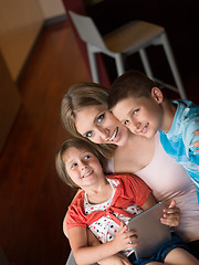 Image showing Young Family Using A Tablet To Make Future Plans