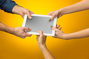 Image showing female teen hands using tablet pc with black screen, isolated