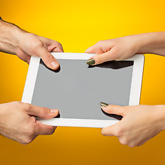 Image showing female teen hands using tablet pc with black screen, isolated