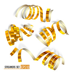 Image showing Set of gold curling streamers on white