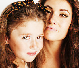 Image showing young mother with little cute daughter emotional posing on white