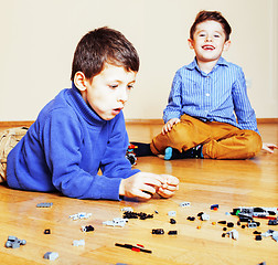 Image showing funny cute children playing toys at home, boys and girl smiling,