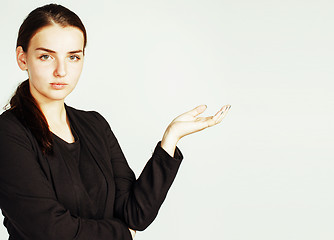 Image showing young pretty businesswoman girl pointing on white background, business science people concept