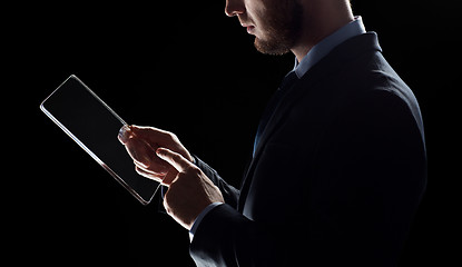 Image showing close up of businessman with transparent tablet pc