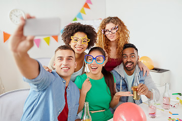 Image showing happy team taking selfie at office party