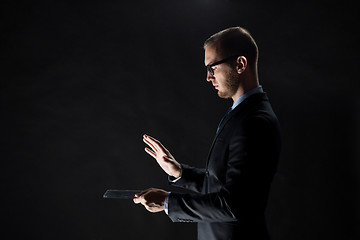 Image showing close up of businessman with transparent tablet pc