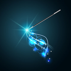 Image showing Magic wand with magical blue sparkle trail