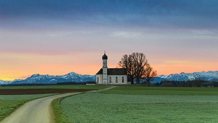 Image showing Morning Alpine landscape with sunrise over St. Andreas chapel