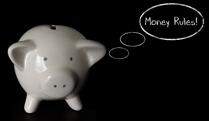 Image showing Piggy bank with thought bubbles, thinking MONEY RULES!