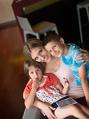 Image showing Young Family Using A Tablet To Make Future Plans