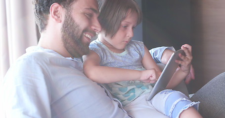 Image showing Father Daughter using Tablet in modern apartment