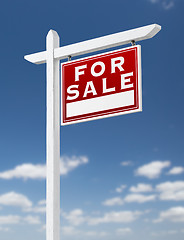 Image showing Right Facing For Sale Real Estate Sign on a Blue Sky with Clouds