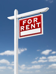 Image showing Right Facing For Rent Real Estate Sign on a Blue Sky with Clouds