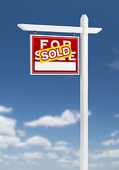 Image showing Left Facing Sold For Sale Real Estate Sign on a Blue Sky with Cl