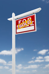 Image showing Right Facing Sold For Sale Real Estate Sign on a Blue Sky with C