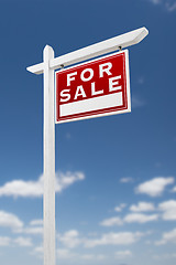 Image showing Right Facing For Sale Real Estate Sign on a Blue Sky with Clouds