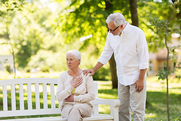 Image showing senior woman feeling sick at summer park