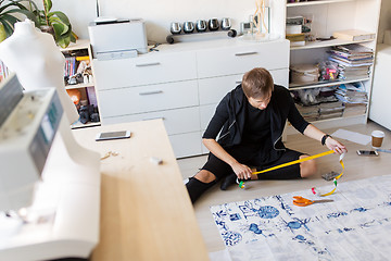 Image showing fashion designer making dress at sewing studio