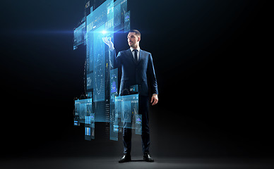 Image showing businessman in suit with virtual projection