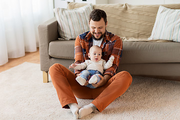 Image showing happy father with little baby boy at home