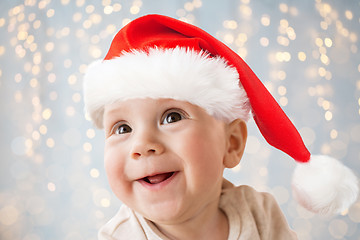 Image showing close up of happy little baby boy in santa hat