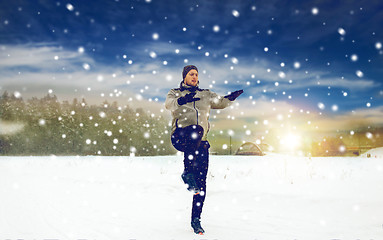 Image showing man exercising and warmig up in winter outdoors