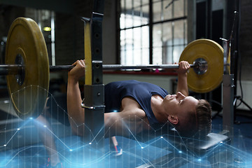 Image showing young man flexing muscles with barbell in gym